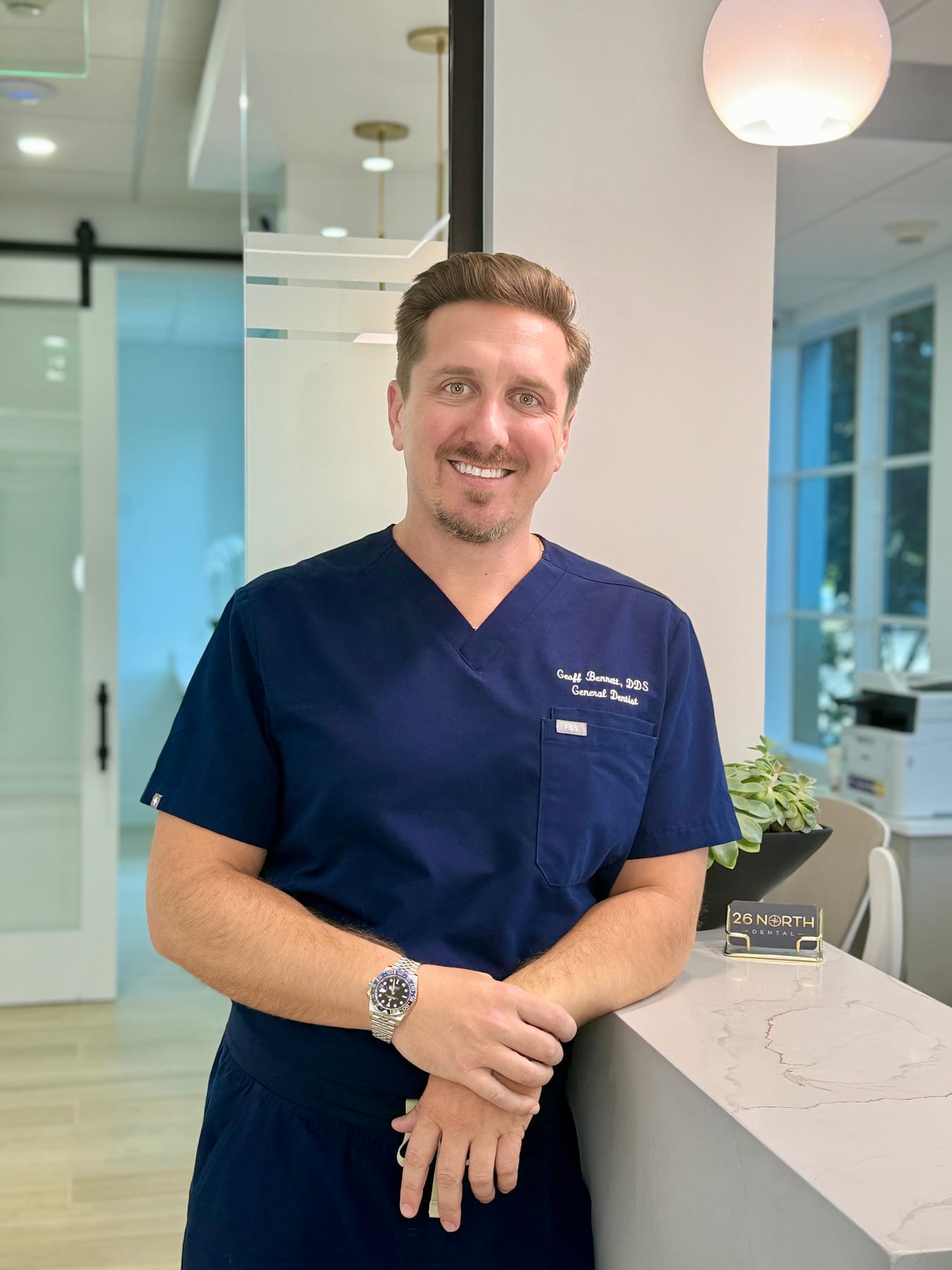 Dr. Geoffrey Bennett in scrubs
